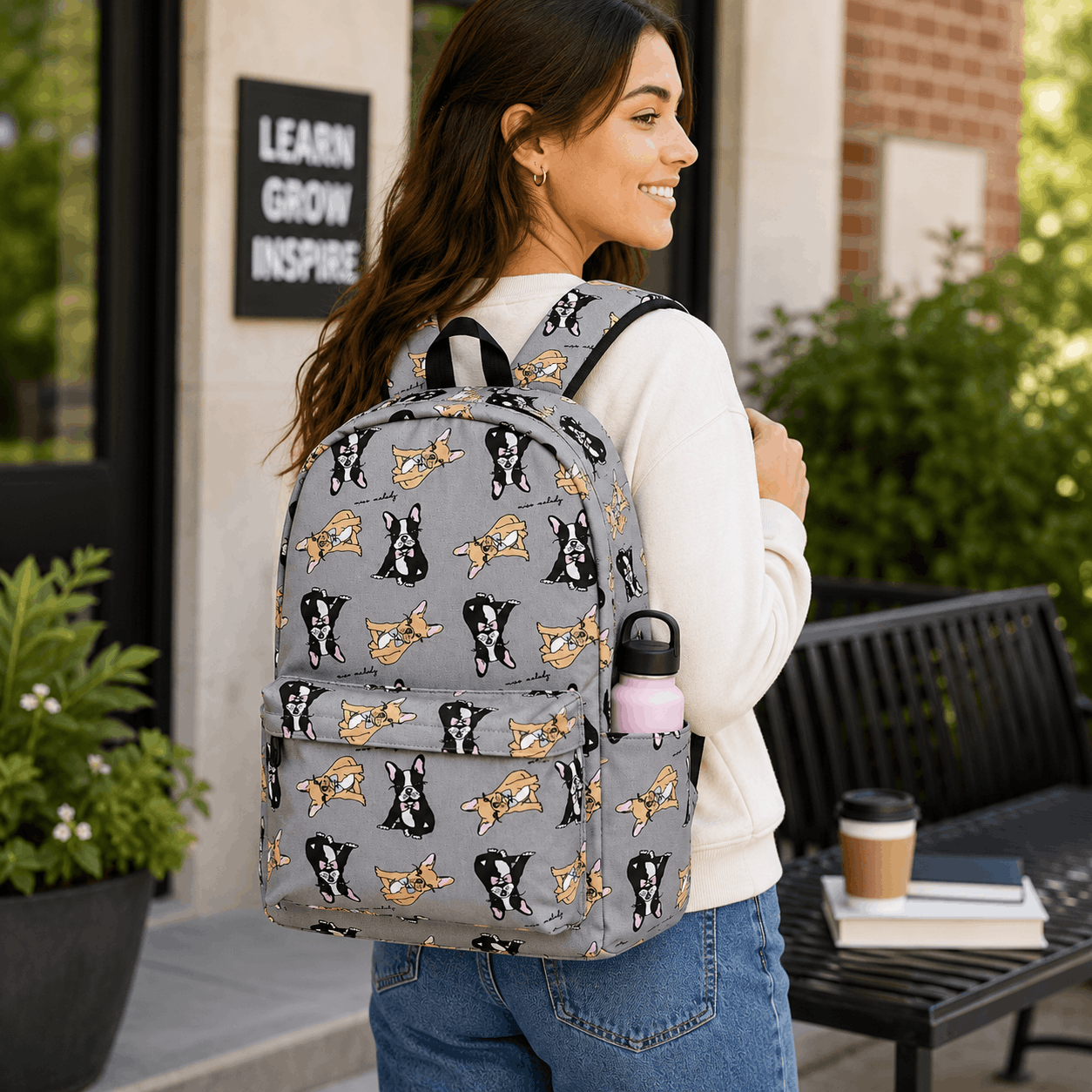 Person wearing Boston Terrier backpack outdoors on campus