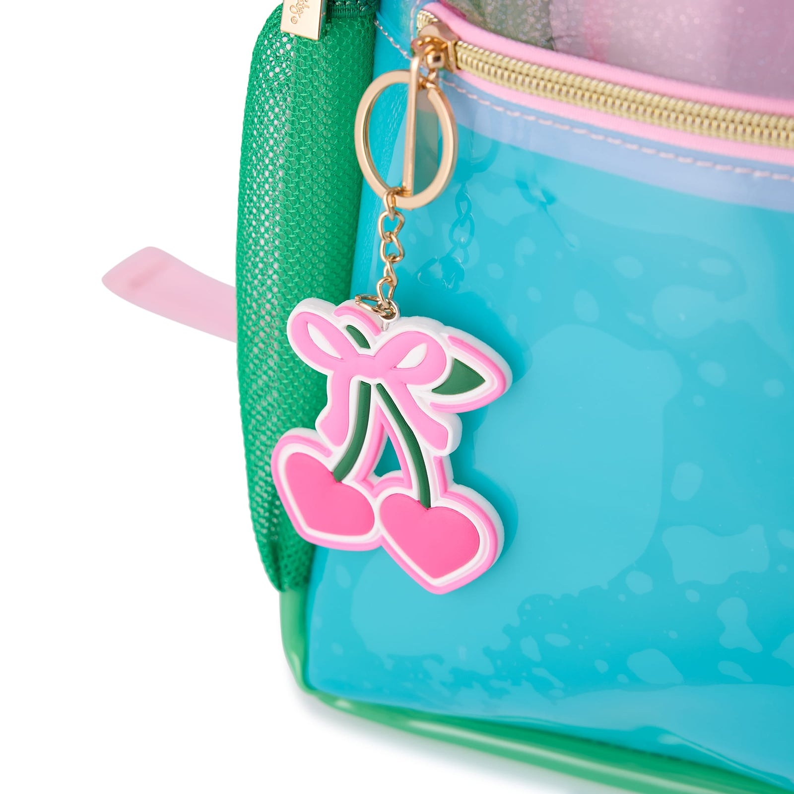 Close-up of the cherry zipper charm and green mesh pocket on the Clear Color Block Jelly Backpack.