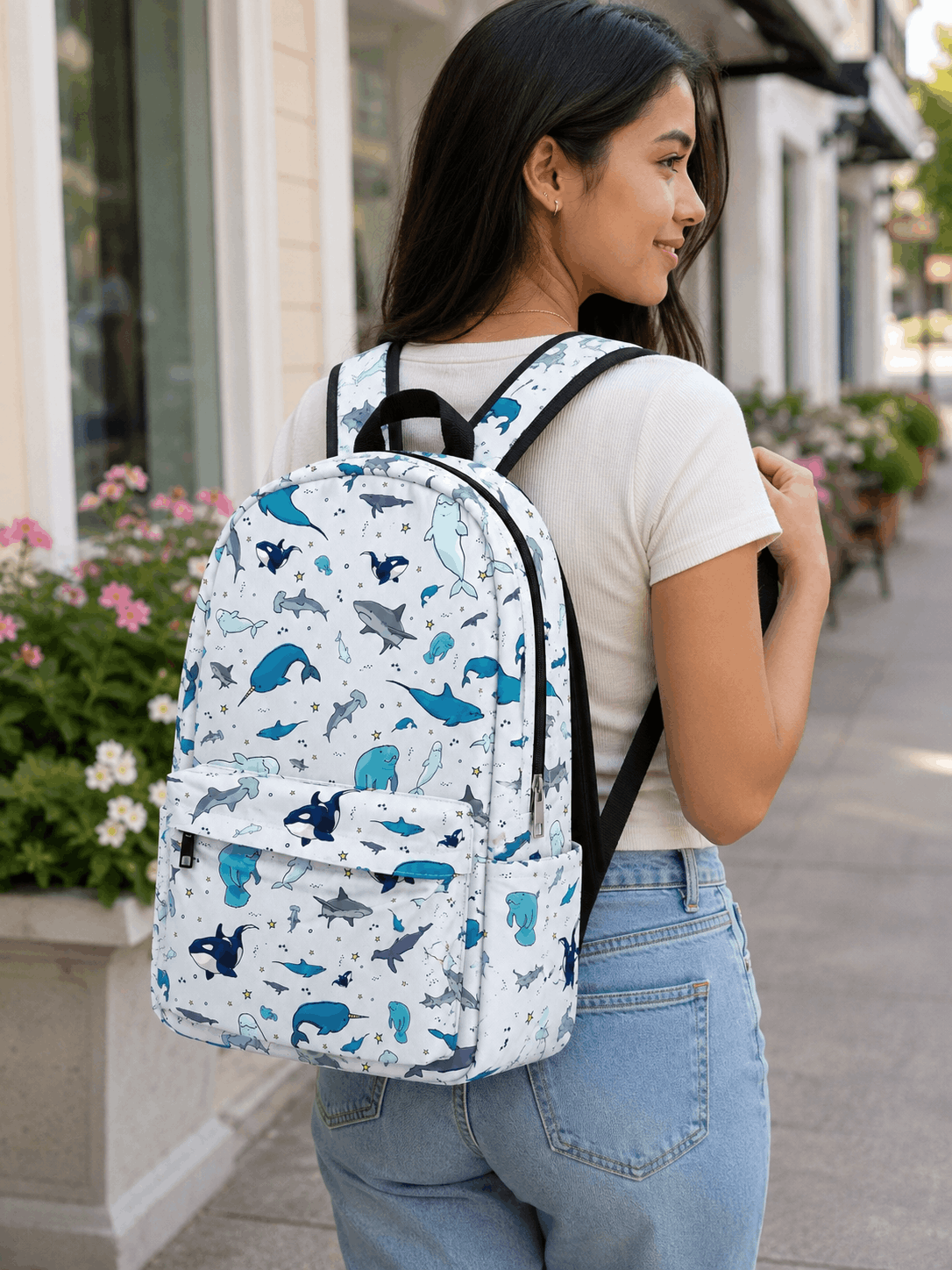 Person wearing the Ocean Life Backpack featuring sharks, whales, and sea animals