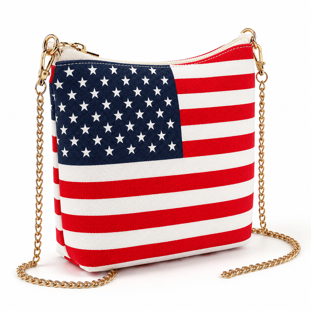 Angled view of an American flag canvas crossbody bag with gold-tone chain strap