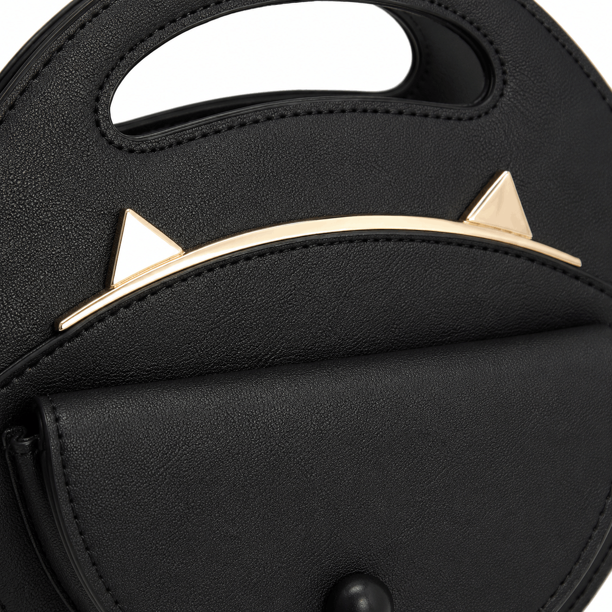 Close-up of the gold cat ear accents on the black cat crossbody bag