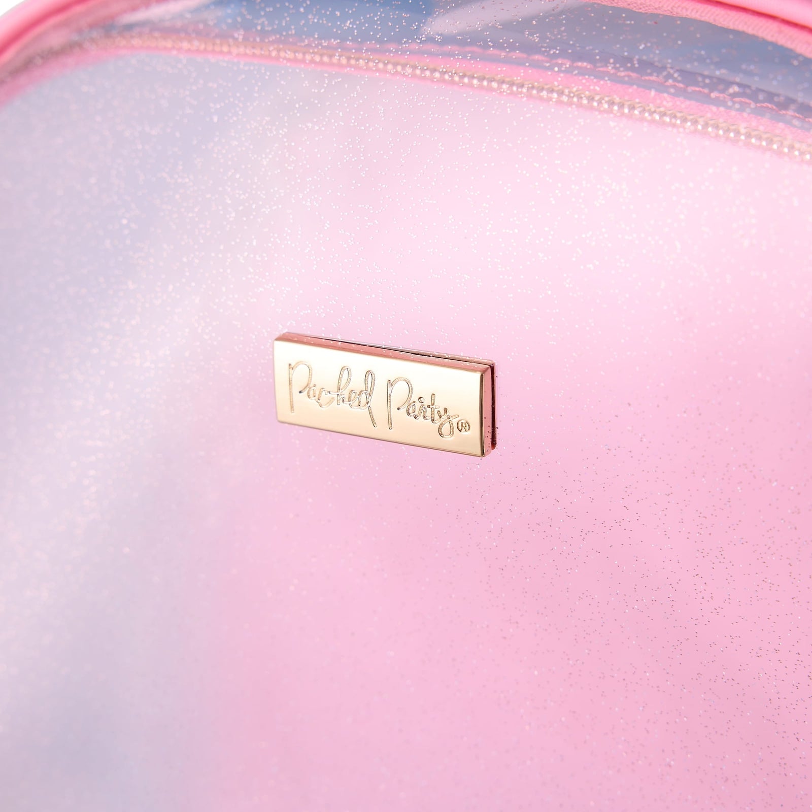 Close-up of the glitter-injected pink panel on the Clear Color Block Jelly Backpack.