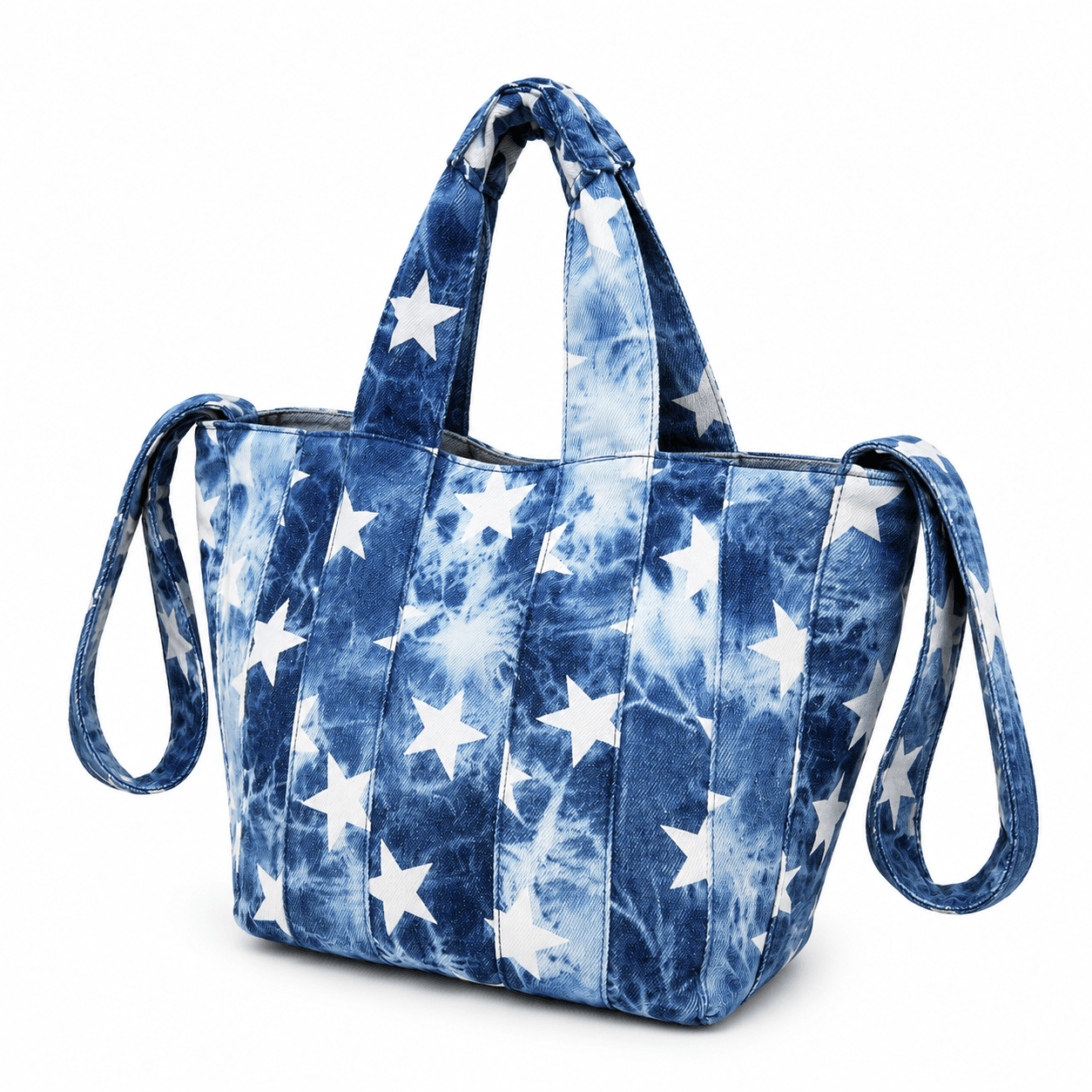 Angled view of the Denim Stars Tote Bag featuring blue tie-dye denim and white stars