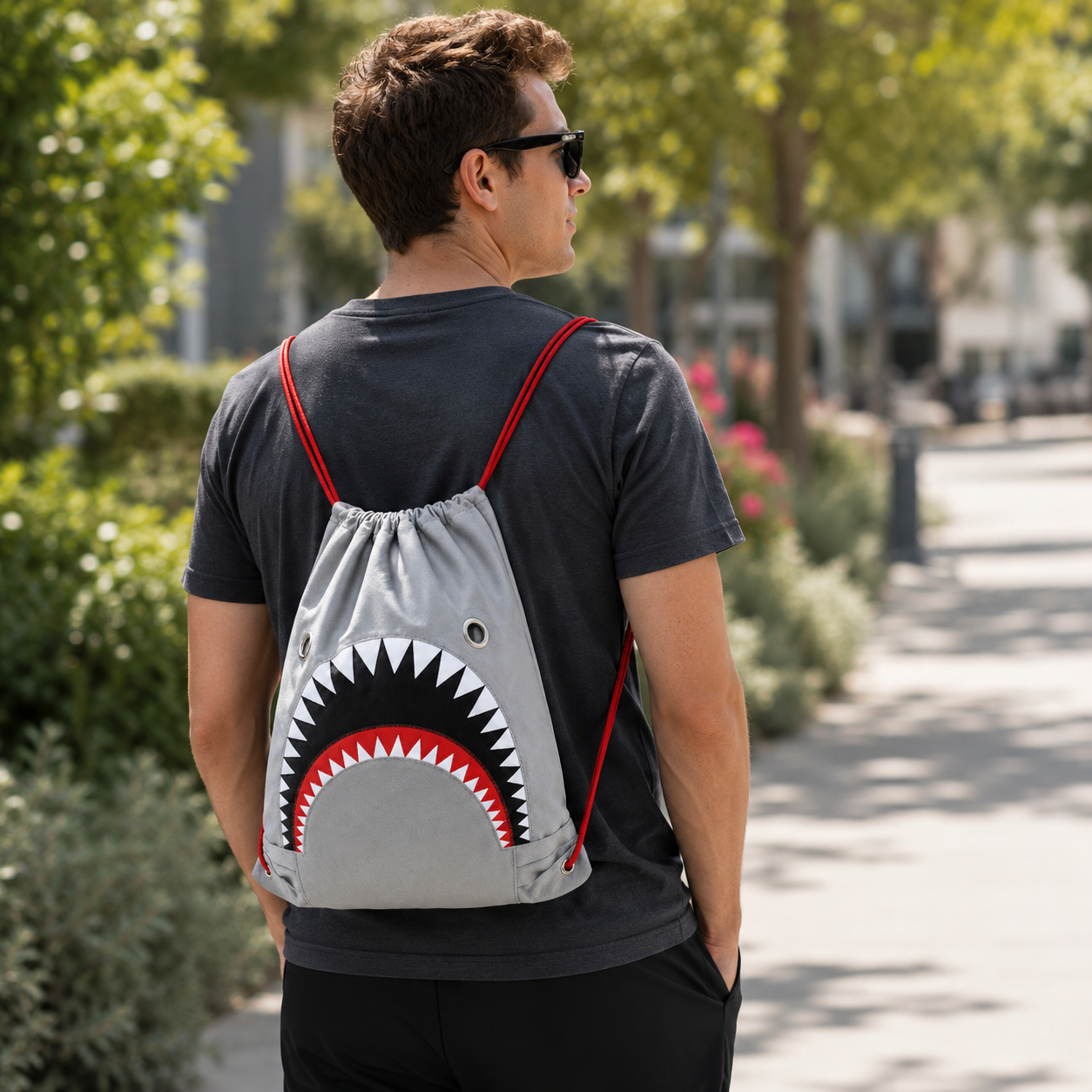 Person wearing the Great White Shark Drawstring Bag outdoors