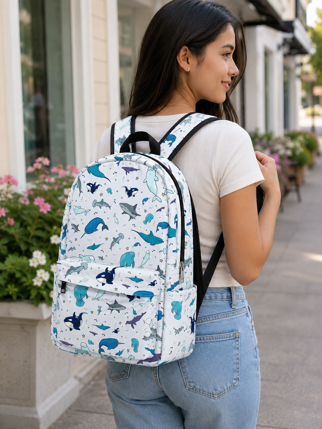 Person wearing the Ocean Life Backpack featuring sharks, whales, and sea animals