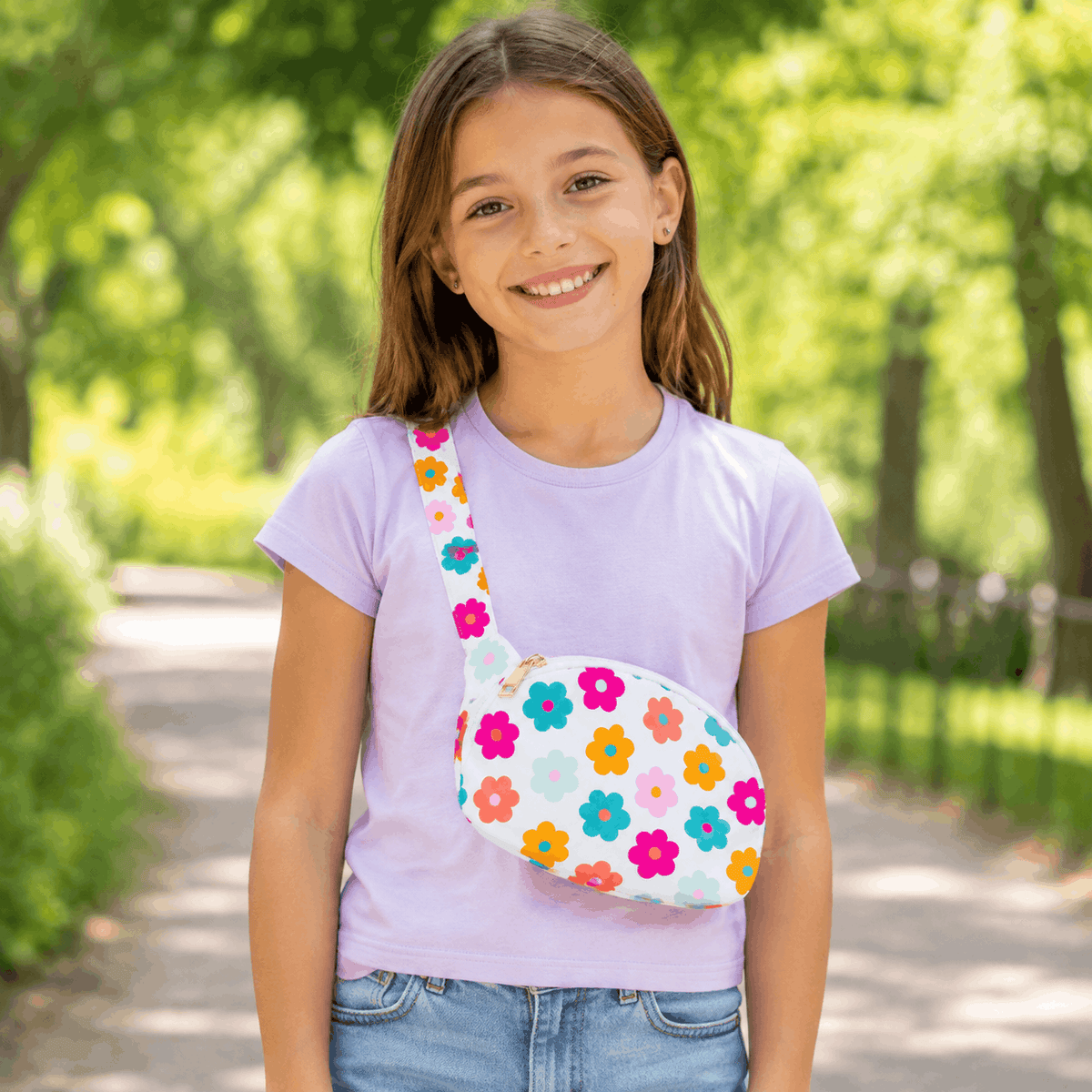 Child wearing the Retro Floral Belt Bag crossbody at a park