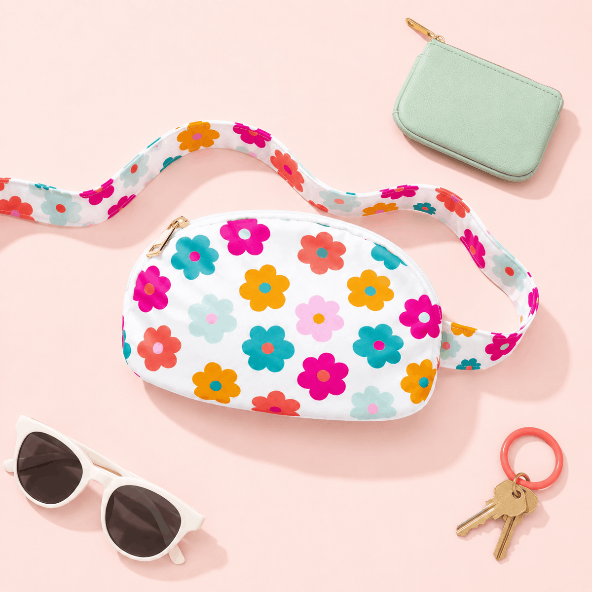 Retro Floral Belt Bag with sunglasses, keys, and a mint coin purse