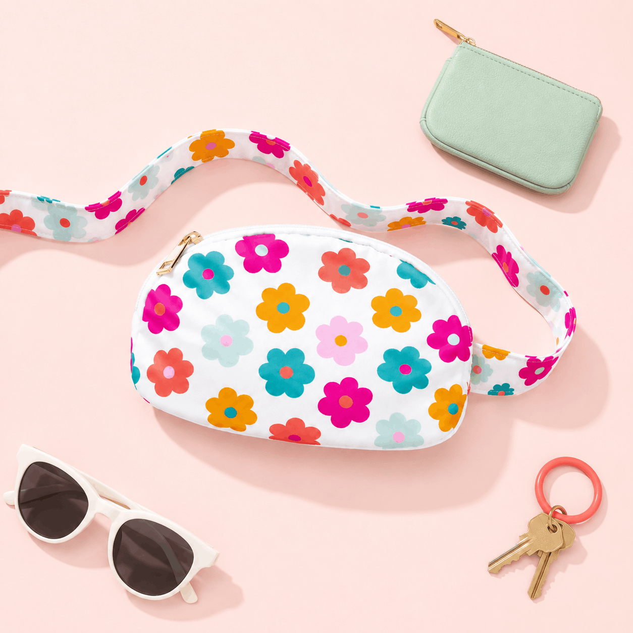 Retro Floral Belt Bag with sunglasses, keys, and a mint coin purse