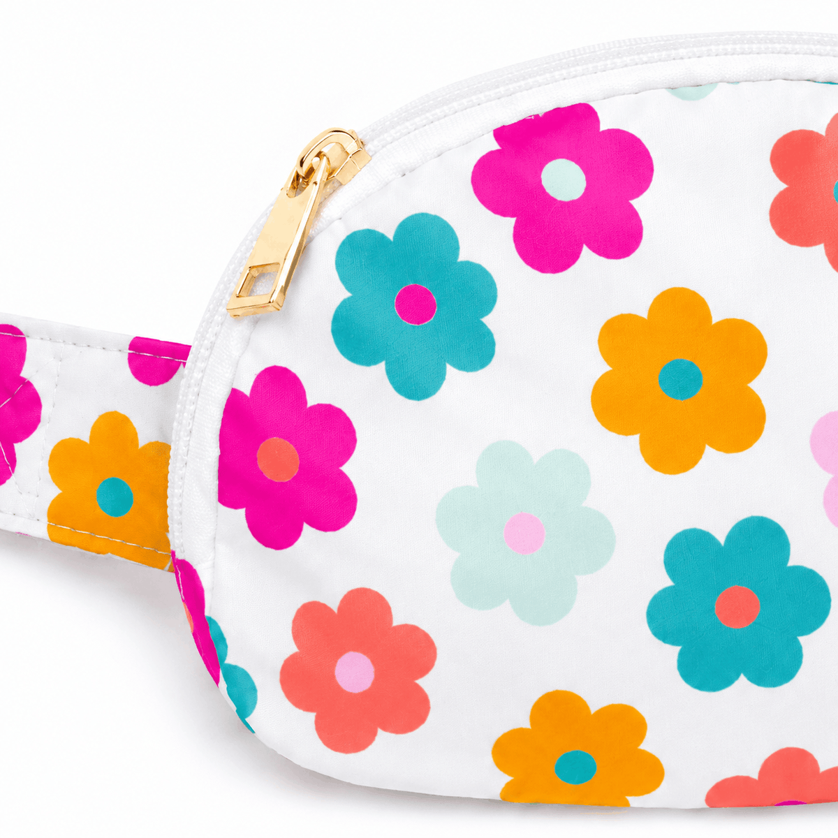 Close-up of the floral print, white trim, and gold-tone zipper pull