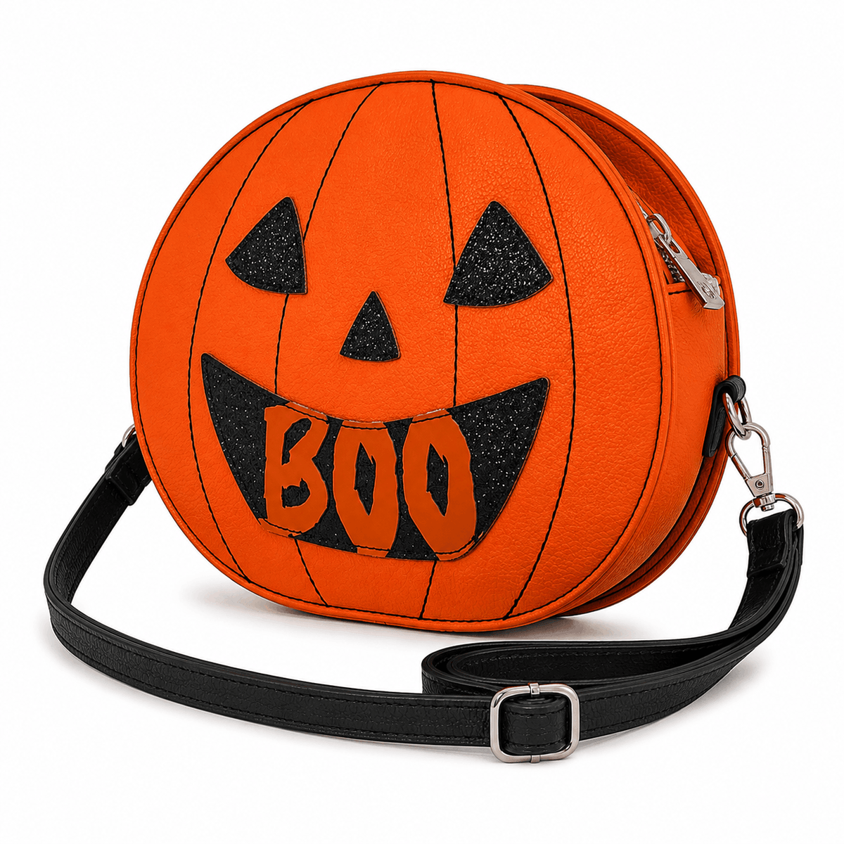 Angled view of the Reversible Jack-O'-Lantern Crossbody Bag highlighting the pumpkin shape, zipper, and adjustable shoulder strap.