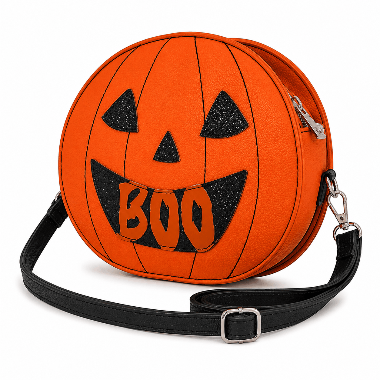 Angled view of the Reversible Jack-O'-Lantern Crossbody Bag highlighting the pumpkin shape, zipper, and adjustable shoulder strap.