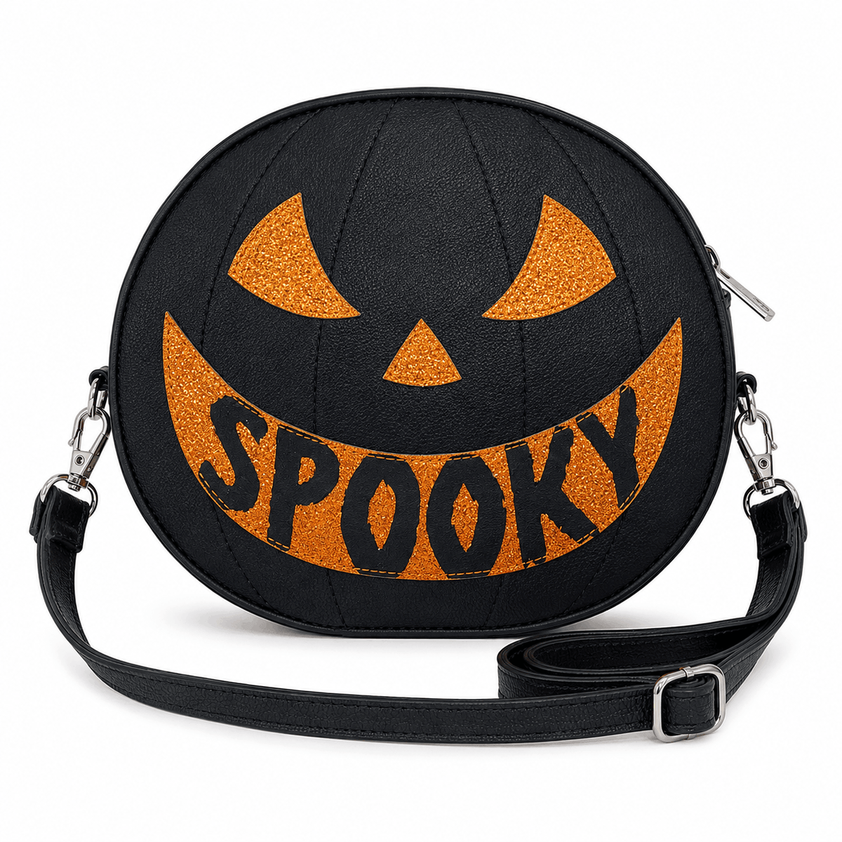 Reversible Jack-O'-Lantern Crossbody Bag showing the black "SPOOKY" pumpkin face with orange glitter accents and adjustable shoulder strap.