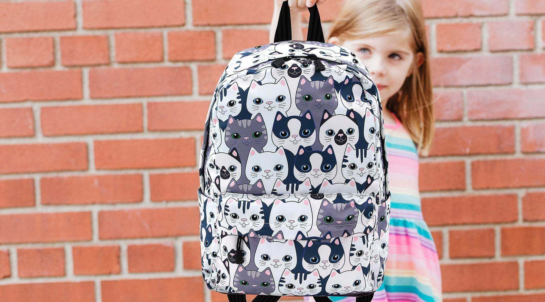Young Girl Holding Cat Backpack | Pakapalooza